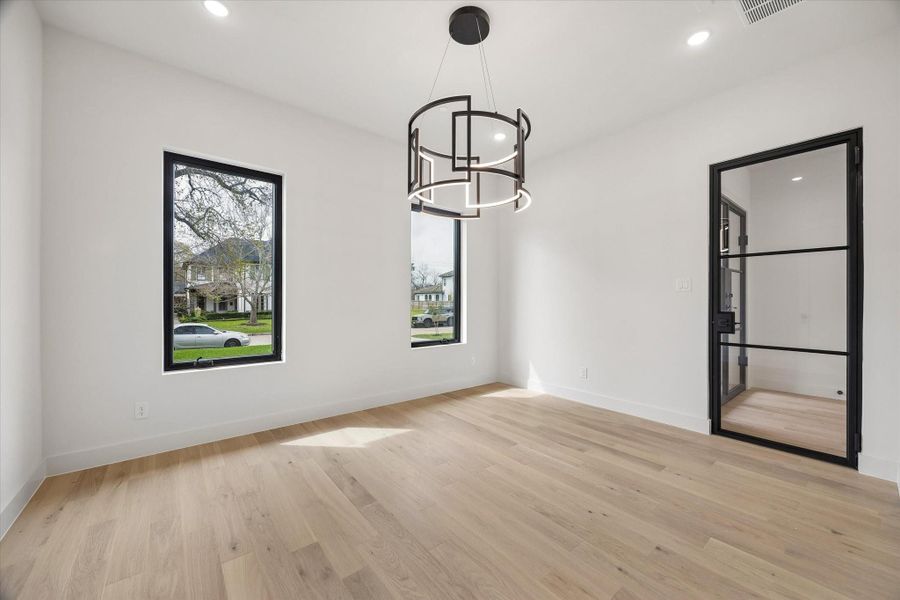 The first floor Study is spacious and centered on its contemporary style chandelier. A metal and glass door closes it off as a peaceful and private place of work time concentration. It has a 5x5 walk-in for storage.