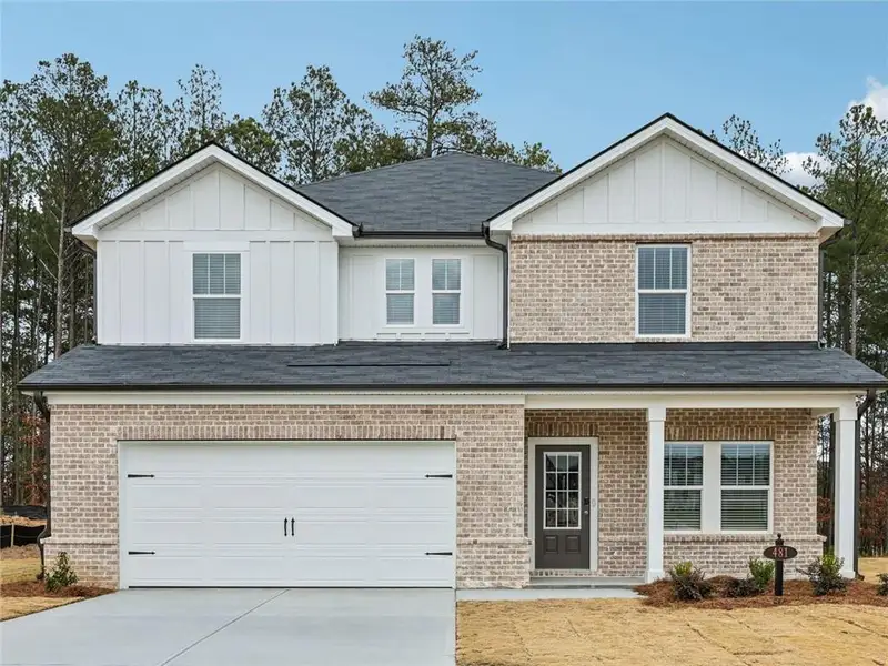 Front exterior of a new home in Northwoods at Mirror Lake, Villa Rica, GA, highlighting curb appeal (Image 1). Front exterior of a new home in Northwoods at Mirror Lake, Villa Rica, GA, highlighting curb appeal (Image 1).