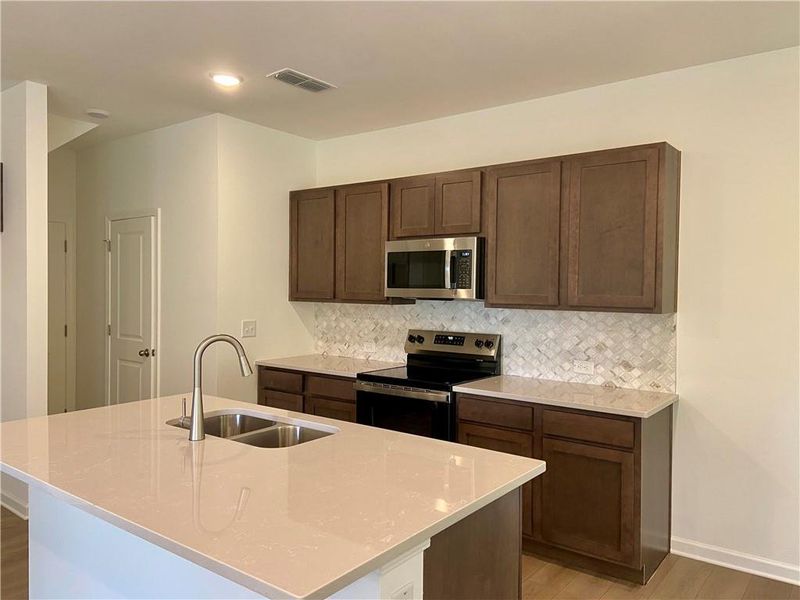 Furnished interior view inside a new home in Eastlyn Crossing, Flowery Branch (Image 6).