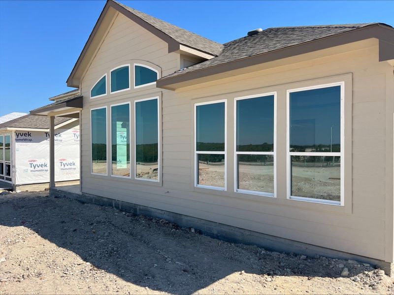 View of side of property with a shingled roof View of side of property with a shingled roof