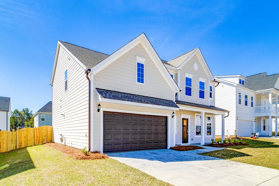 Front exterior of a new home in Pebble Branch, Chapin, SC, highlighting curb appeal (Image 19). Front exterior of a new home in Pebble Branch, Chapin, SC, highlighting curb appeal (Image 19).