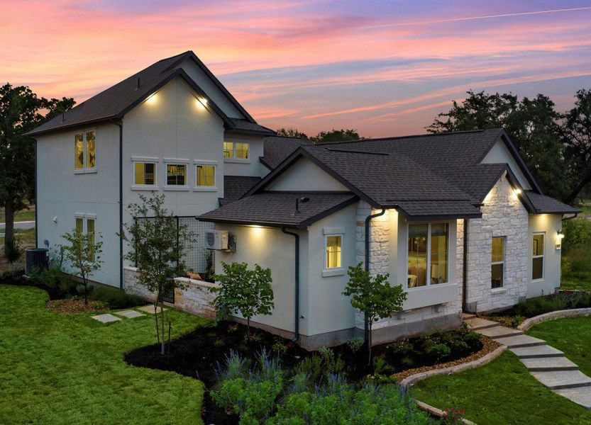 Front exterior of a new home in Parmer Ranch Cottages, Georgetown, TX, highlighting curb appeal (Image 2). Front exterior of a new home in Parmer Ranch Cottages, Georgetown, TX, highlighting curb appeal (Image 2).
