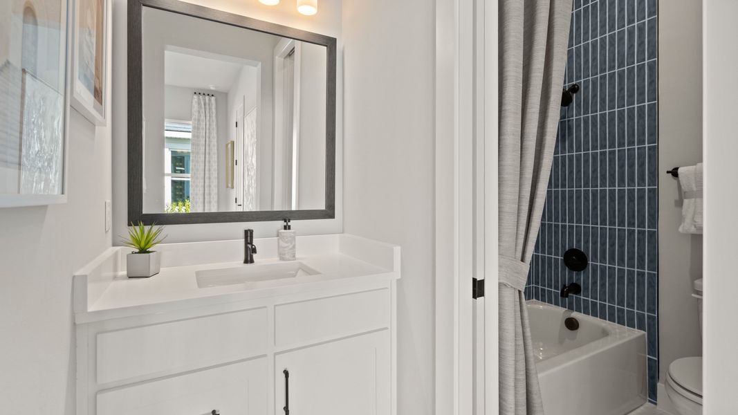 Representative furnished interior of a home built from the 2844F by Perry Homes in Glynlea Country Club 60', Port St. Lucie (Image 22).