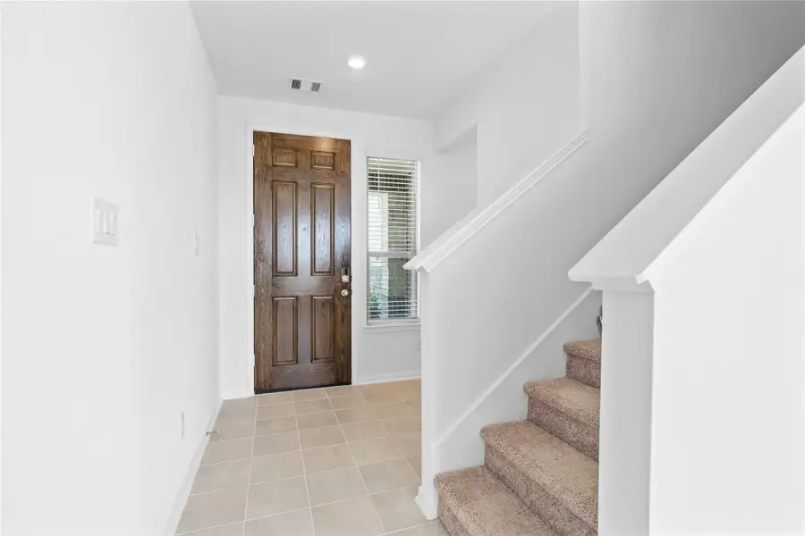 Step inside your new home, where the Coastline ceramic tile flooring and fresh, bright paint create a warm and inviting entryway. Step inside your new home, where the Coastline ceramic tile flooring and fresh, bright paint create a warm and inviting entryway.