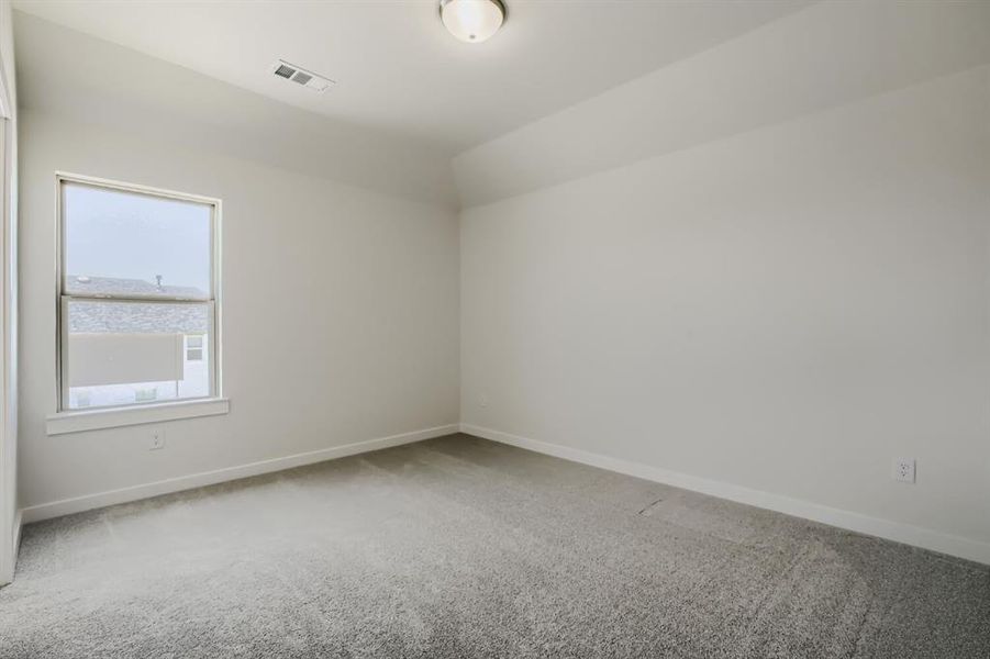 Room featuring light grey carpeting, white baseboards, and neutral wall paint