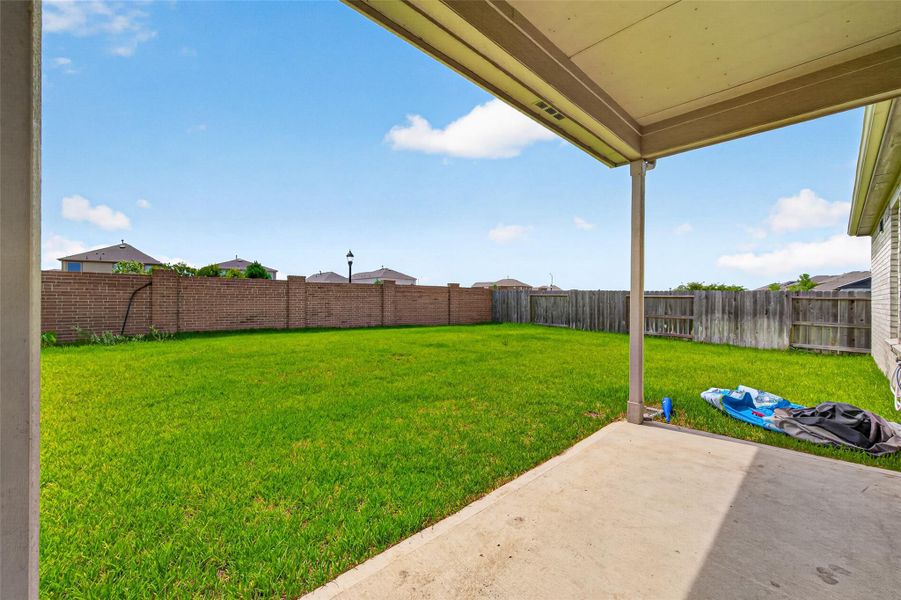 Exterior details and patio area of a home in Marvida, Cypress (Image 33).