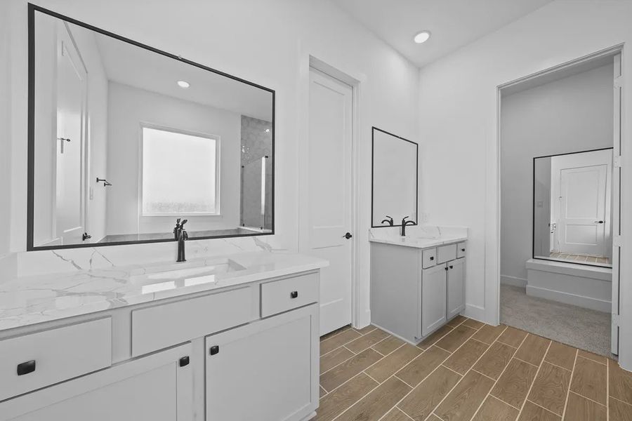 Representative furnished interior of a home built from the Summerton by Chesmar Homes in University Heights, Round Rock (Image 13).
