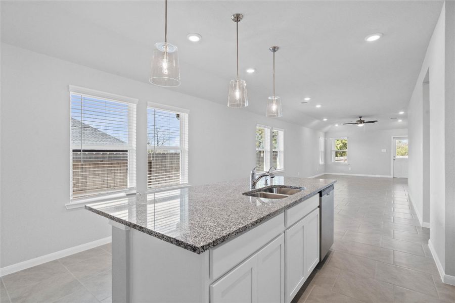 From the expansive kitchen island, enjoy seamless sightlines across the open-concept living and dining areas, making entertaining a breeze and ensuring you're never far from the conversation.