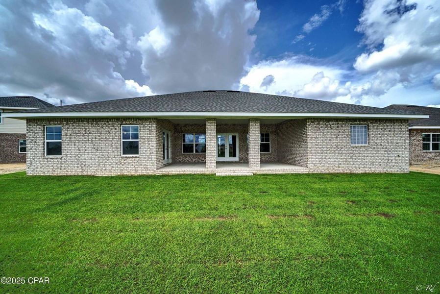 Front exterior of a new home in Cedar Creek at Deerpoint Lake, Panama City, FL, highlighting curb appeal (Image 2). Front exterior of a new home in Cedar Creek at Deerpoint Lake, Panama City, FL, highlighting curb appeal (Image 2).