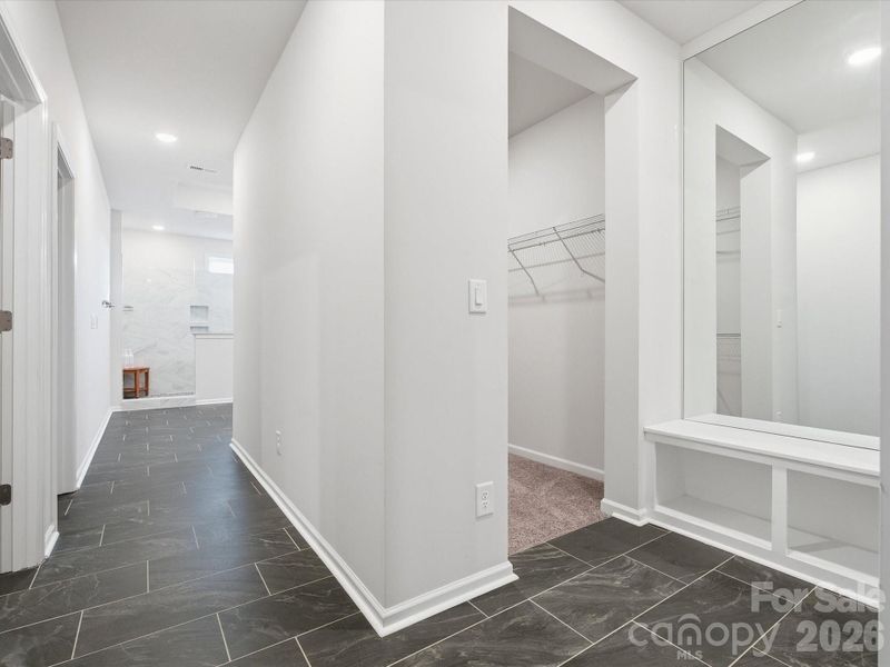 The HALLWAY of the primary bath/closets!