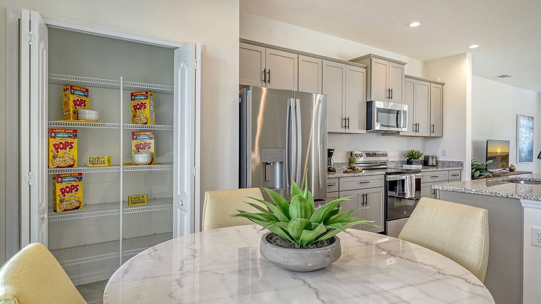 Furnished interior view inside a new home in SkySail, Naples (Image 7).