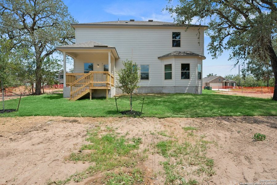 Front exterior of a new home in Jordan's Ranch, San Antonio, TX, highlighting curb appeal (Image 1). Front exterior of a new home in Jordan's Ranch, San Antonio, TX, highlighting curb appeal (Image 1).