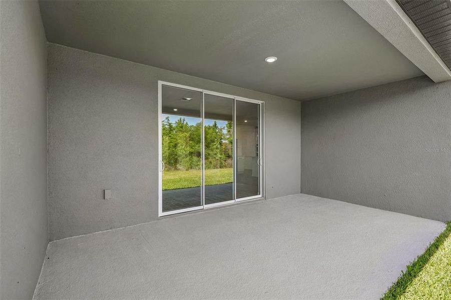 Exterior details and patio area of a home in The Grove at Stuart Crossing - Signature Series, Bartow (Image 24).