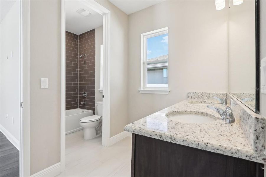 Furnished interior view inside a new home in Laureate Park, Orlando (Image 5).