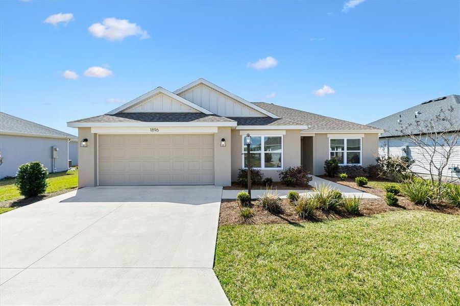 Front exterior of a new home in , The Villages, FL, highlighting curb appeal (Image 20).