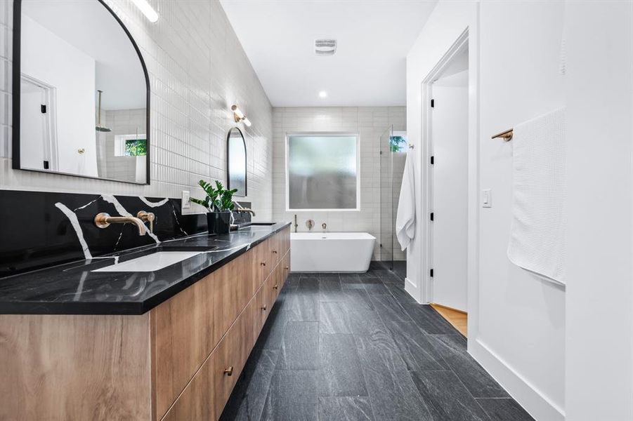 Luxurious primary ensuite bathroom with dual floating vanity