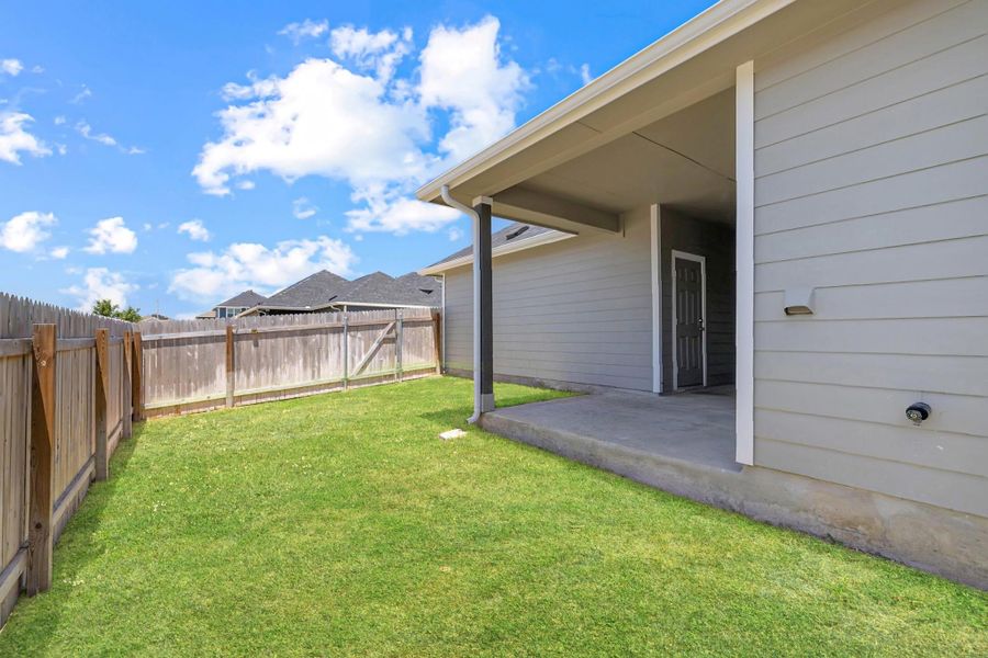 Fenced backyard with a patio Fenced backyard with a patio