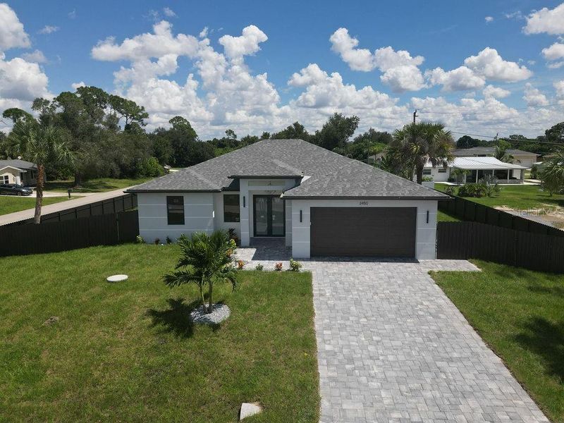 Front exterior of a new home in , Port Charlotte, FL, highlighting curb appeal (Image 26).
