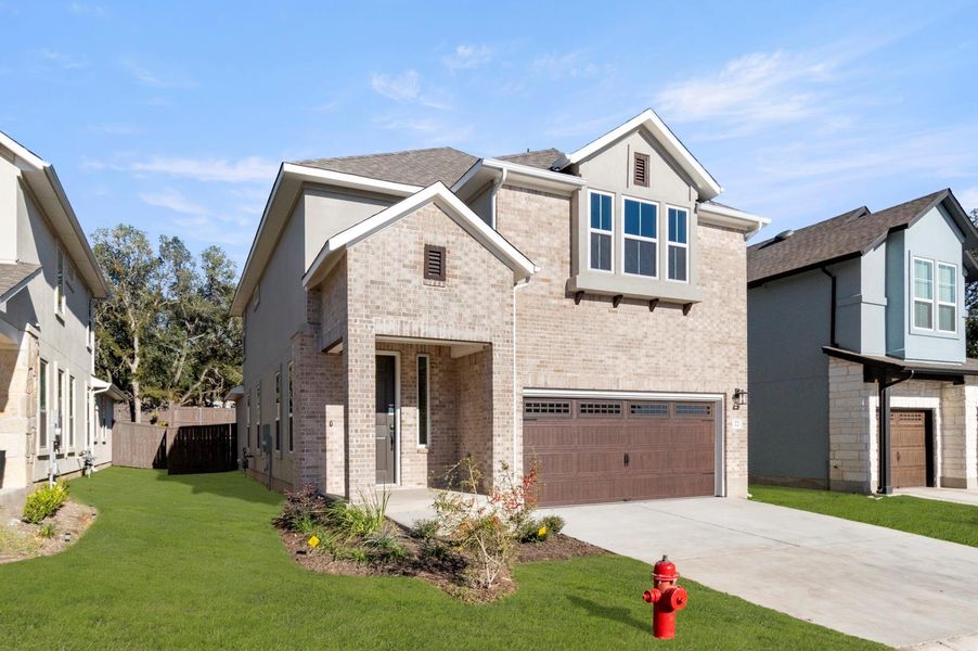 Front exterior of a new home in Clear Creek, Round Rock, TX, highlighting curb appeal (Image 19).