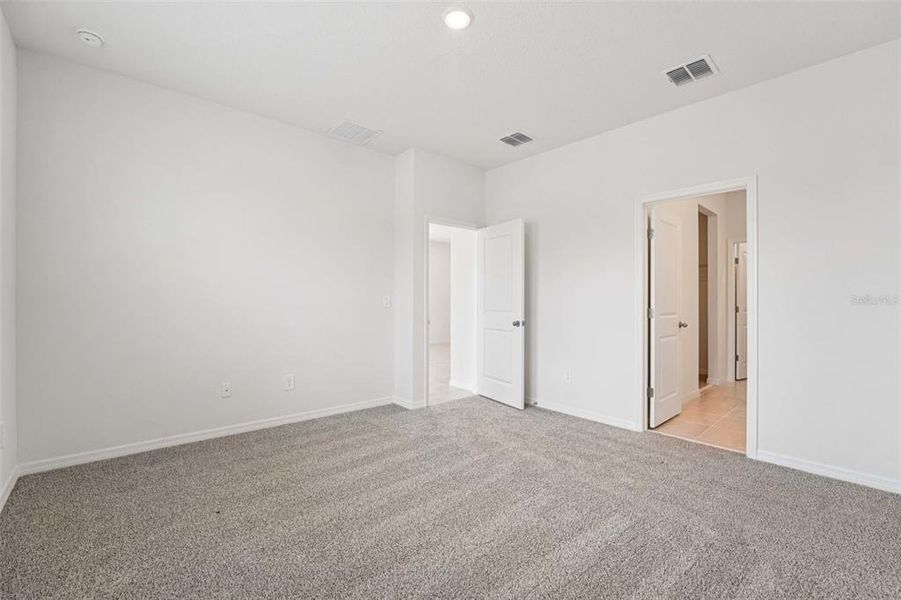 Spacious, unfurnished interior of a new home in The Grove at Stuart Crossing - Premier Series, Bartow (Image 11). Spacious, unfurnished interior of a new home in The Grove at Stuart Crossing - Premier Series, Bartow (Image 11).