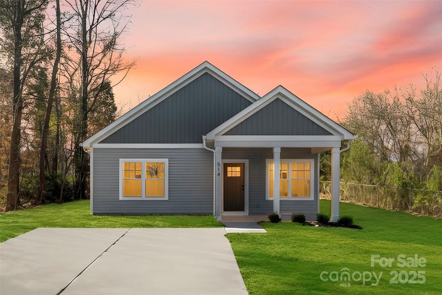 Front exterior of a new home in , East Spencer, NC, highlighting curb appeal (Image 22).