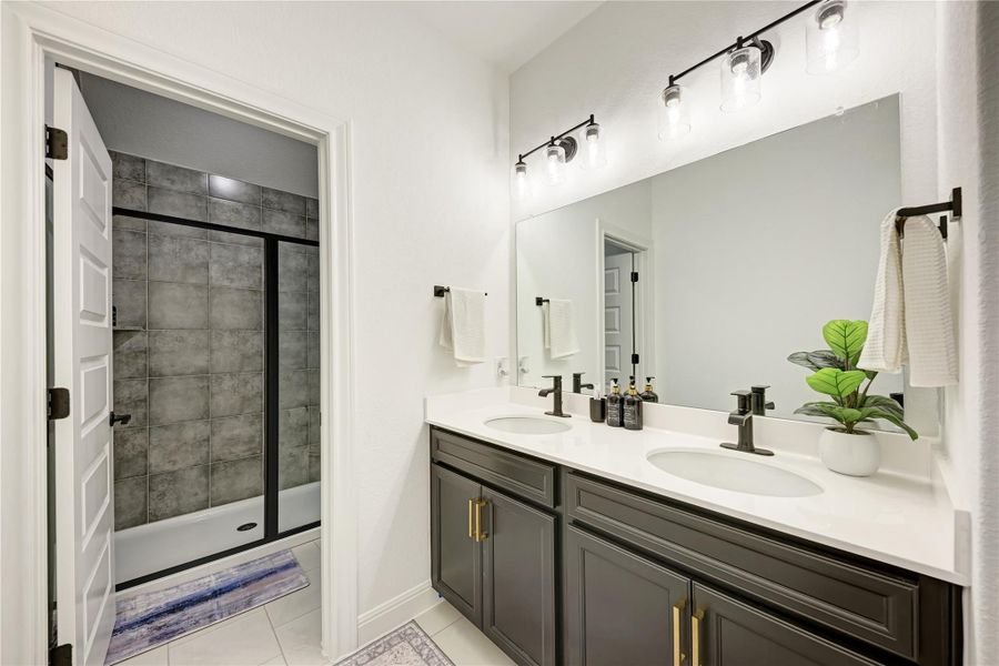 Dual vanity with quartz countertop, undermount sinks, and matte black fixtures