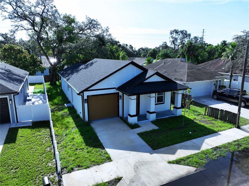 Front exterior of a new home in , Tampa, FL, highlighting curb appeal (Image 15). Front exterior of a new home in , Tampa, FL, highlighting curb appeal (Image 15).