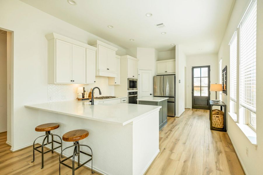 View from the Living Room into the Kitchen & Entryway