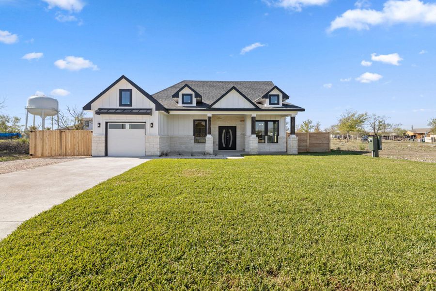Front exterior of a new home in , Dale, TX, highlighting curb appeal (Image 24).