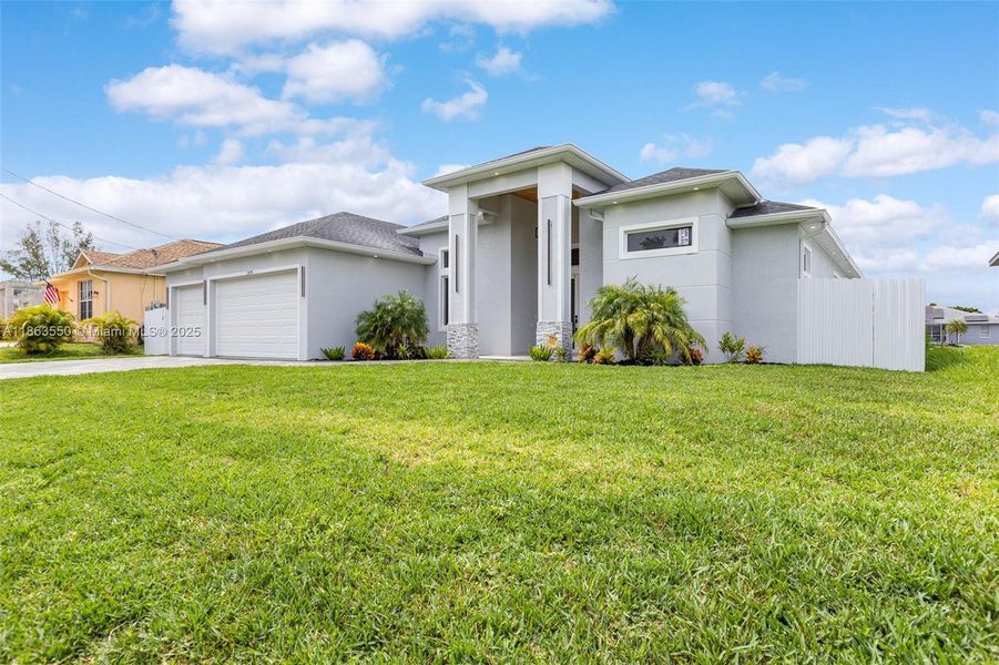 Front exterior of a new home in , Cape Coral, FL, highlighting curb appeal (Image 23). Front exterior of a new home in , Cape Coral, FL, highlighting curb appeal (Image 23).