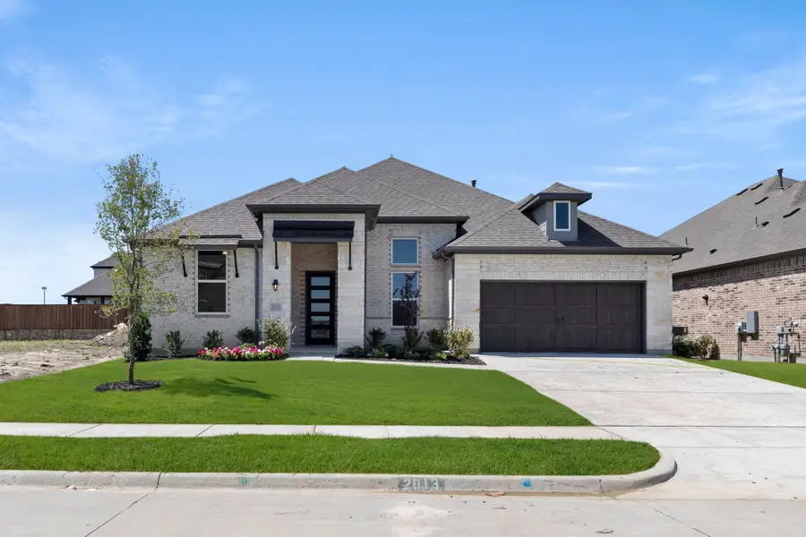 Front exterior of a new home in Nelson Lake Estates, Rockwall, TX, highlighting curb appeal (Image 1). Front exterior of a new home in Nelson Lake Estates, Rockwall, TX, highlighting curb appeal (Image 1).