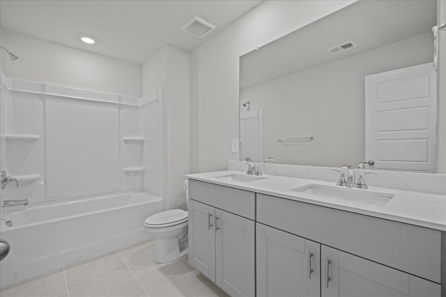 Furnished interior view inside a new home in The Farm at Wells Creek - Signature Collection, Gray Court (Image 7).