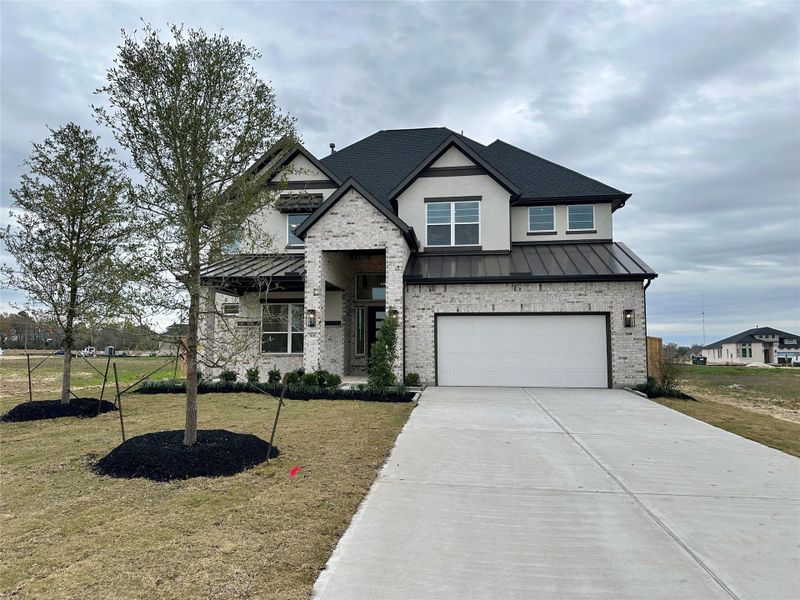 Front exterior of a new home in Briarley, Montgomery, TX, highlighting curb appeal (Image 23).