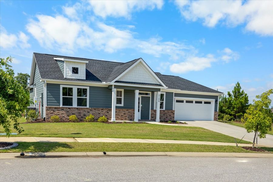 Front exterior of a new home in Sinclair at Crawford Creek, Grovetown, GA, highlighting curb appeal (Image 2). Front exterior of a new home in Sinclair at Crawford Creek, Grovetown, GA, highlighting curb appeal (Image 2).