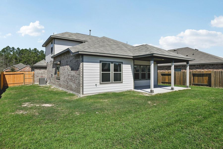 Exterior details and patio area of a home in Splendora Fields, Splendora (Image 24).