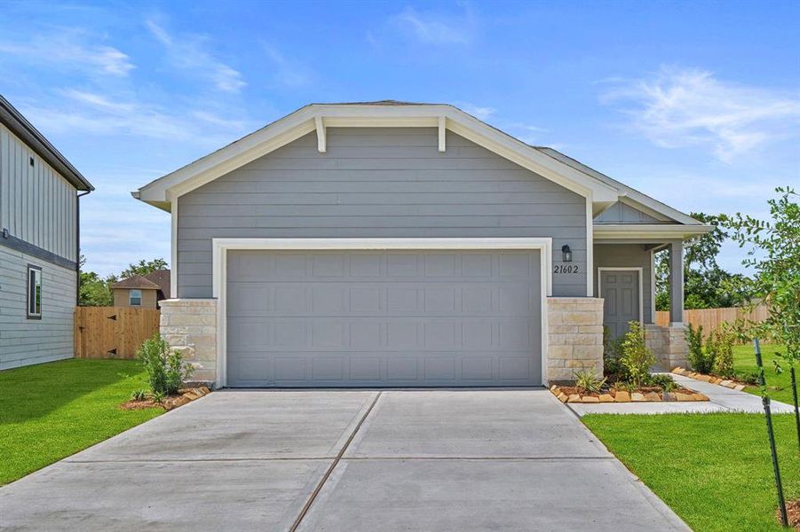 Front exterior of a new home in Peppervine, Porter, TX, highlighting curb appeal (Image 13). Front exterior of a new home in Peppervine, Porter, TX, highlighting curb appeal (Image 13).
