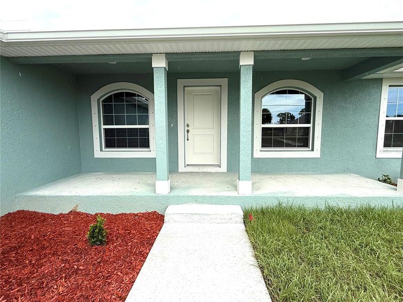 Front exterior of a new home in Rotonda, Rotonda West, FL, highlighting curb appeal (Image 14).