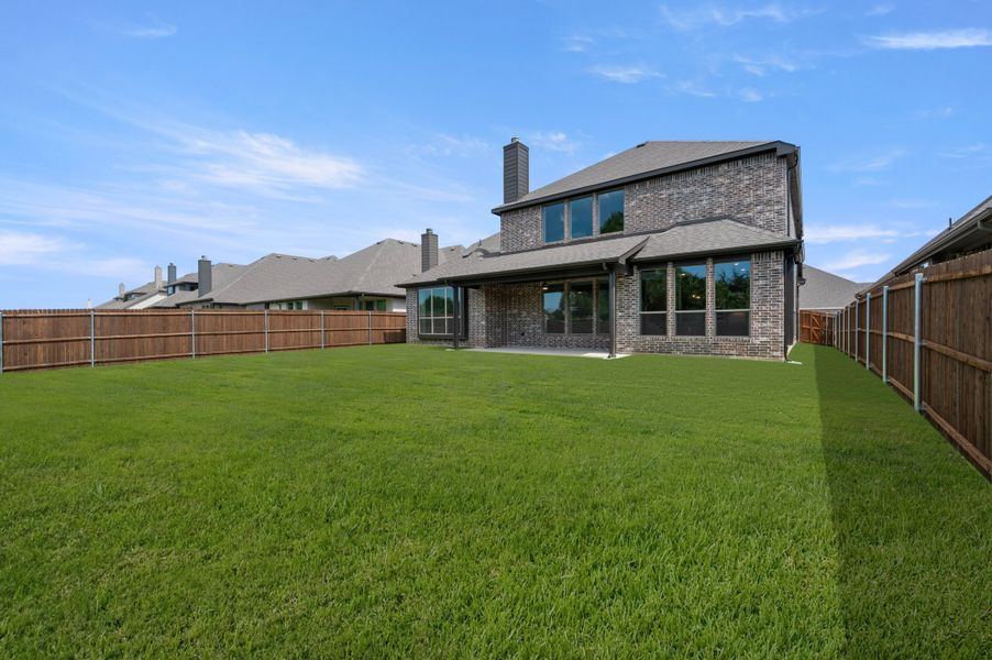 Exterior details and patio area of a home in Mockingbird Hills - Signature Series, Joshua (Image 18).