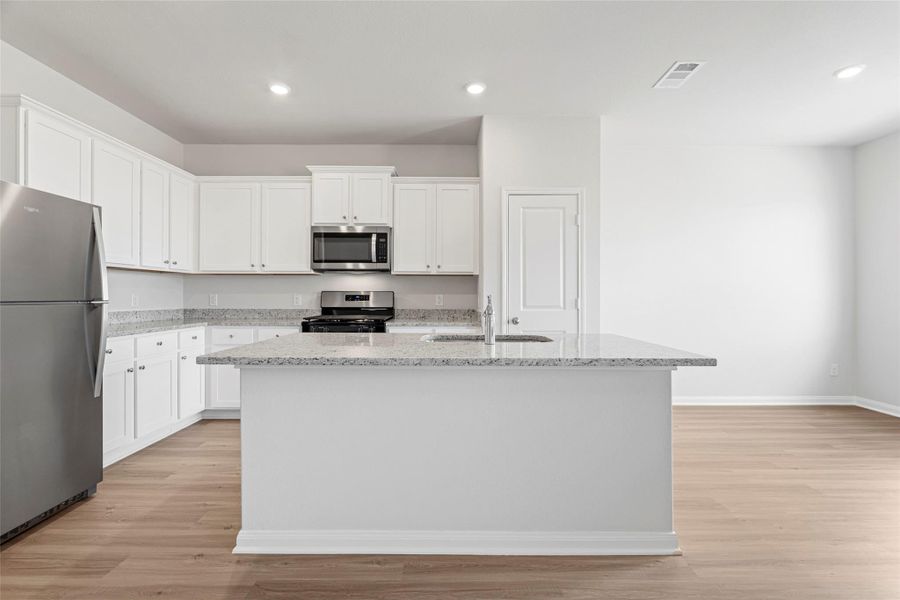 Furnished interior view inside a new home in Canterra Creek, Iowa Colony (Image 3).