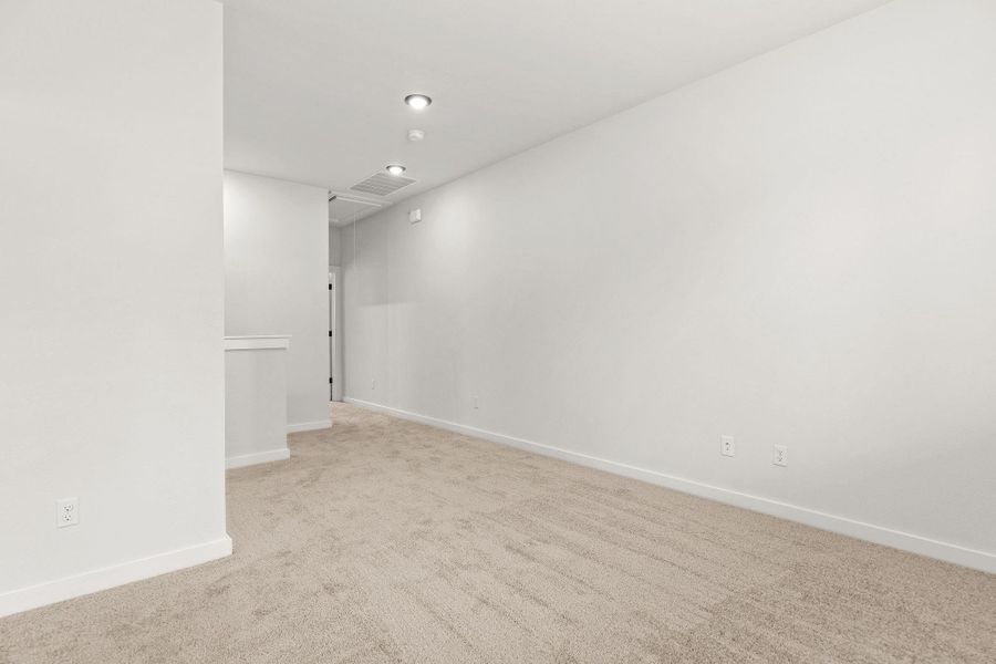 An airy room offers plush carpeting and discreet recessed lighting. An airy room offers plush carpeting and discreet recessed lighting.