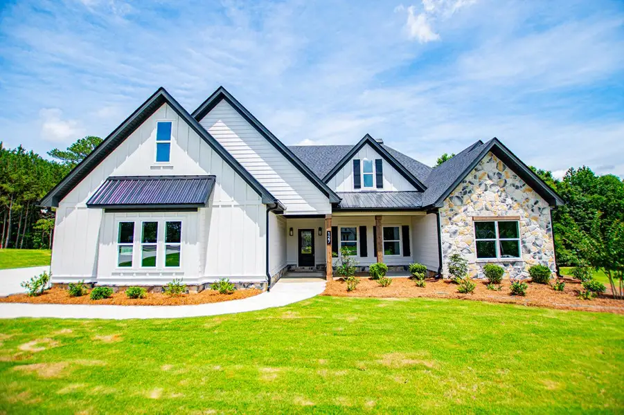 Front exterior of a new home in WOODMONT RESERVE, Roopville, GA, highlighting curb appeal (Image 33).