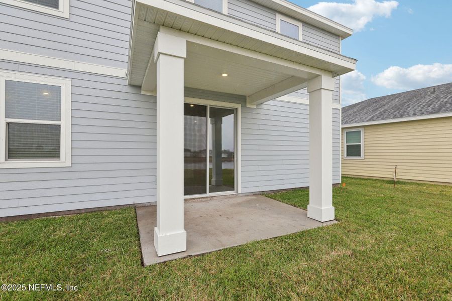 Front exterior of a new home in Lakes at Bella Lago - Signature Series, Green Cove Springs, FL, highlighting curb appeal (Image 18). Front exterior of a new home in Lakes at Bella Lago - Signature Series, Green Cove Springs, FL, highlighting curb appeal (Image 18).