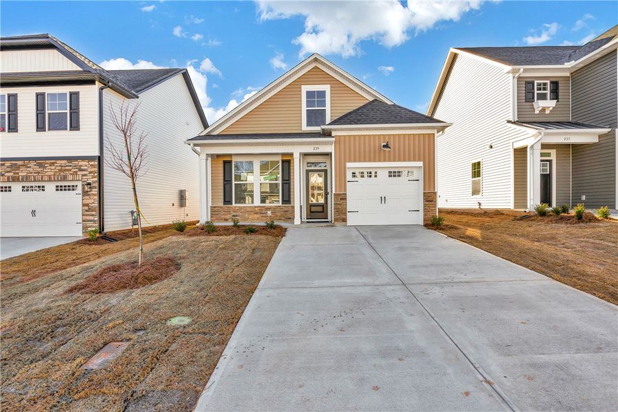 Front exterior of a new home in Brownstone Park, Easley, SC, highlighting curb appeal (Image 2).