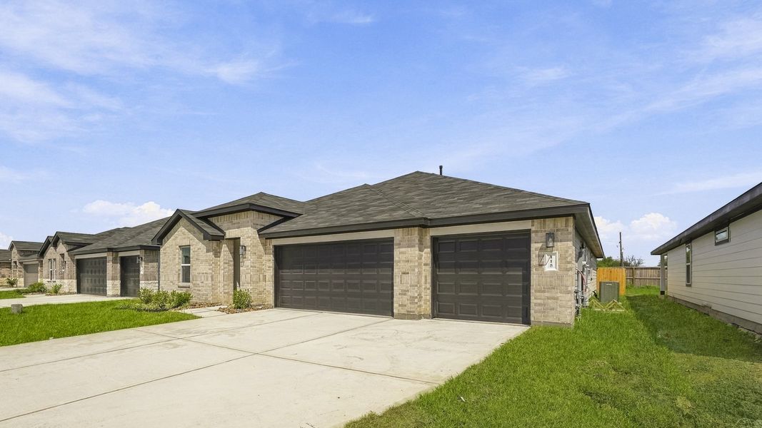 Front exterior of a new home in Medina, Dayton, TX, highlighting curb appeal (Image 16).