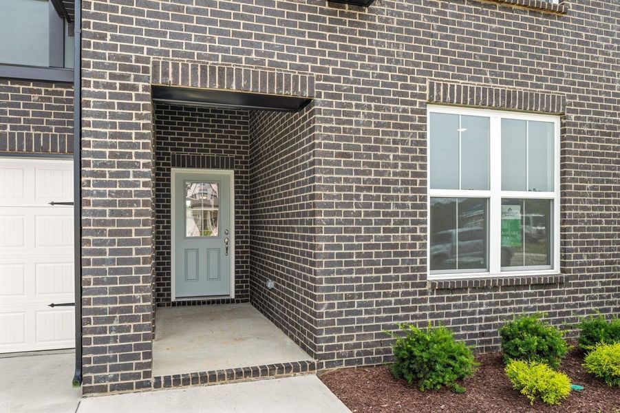 Exterior details and patio area of a home in Woods Crossing, Gallatin (Image 3).