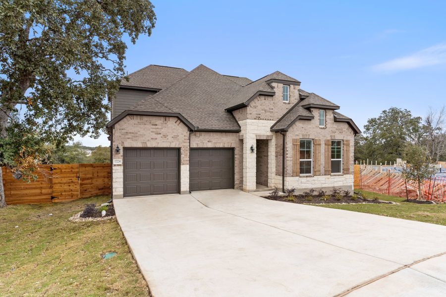 Representative exterior photo of a completed home built from the Waterville by Ashton Woods in The Trails at Carmel, Pflugerville, TX (Image 28).