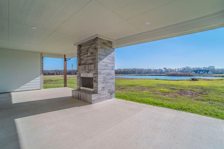 View of patio featuring a fireplace