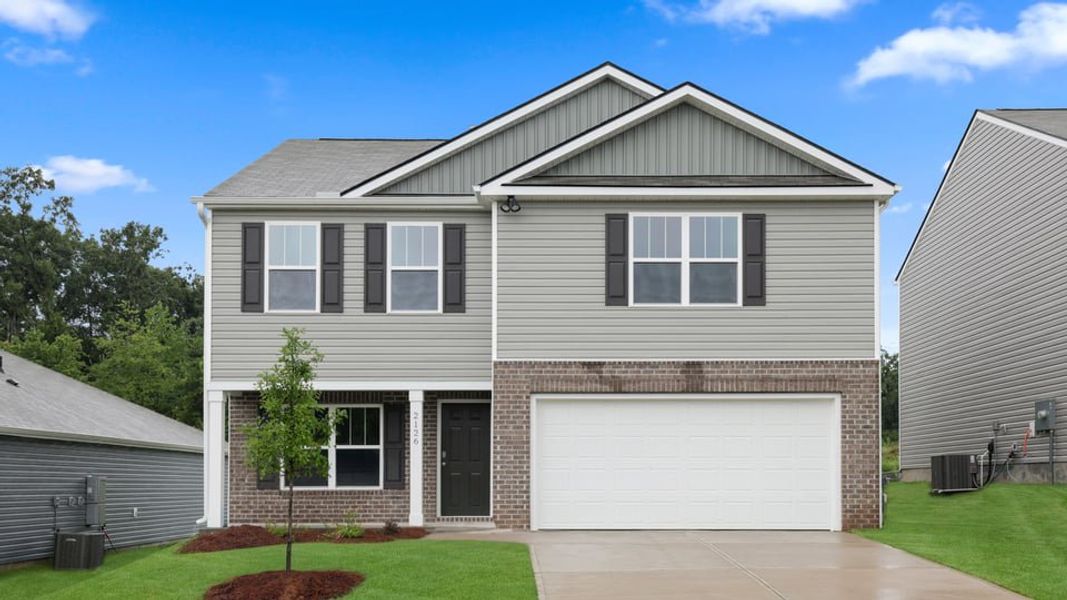 Front exterior of a new home in Harrier Point, Woodruff, SC, highlighting curb appeal (Image 1). Front exterior of a new home in Harrier Point, Woodruff, SC, highlighting curb appeal (Image 1).