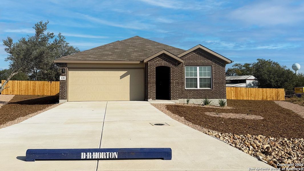 Front exterior of a new home in High Garden, Comfort, TX, highlighting curb appeal (Image 1). Front exterior of a new home in High Garden, Comfort, TX, highlighting curb appeal (Image 1).
