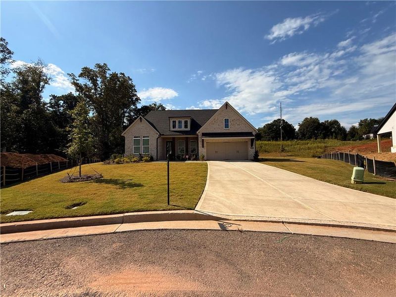 Front exterior of a new home in , Cumming, GA, highlighting curb appeal (Image 27).